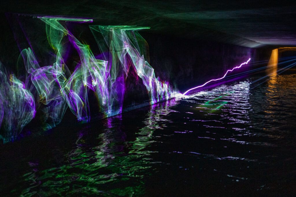 Laser beams are projected on the river Senne in the Sewer Museum, Brussels